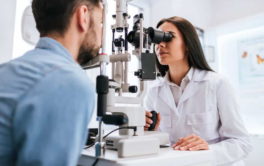 Female Doctor Ophthalmologist Checking Eye