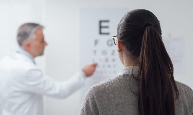Woman Reading The Eye Chart