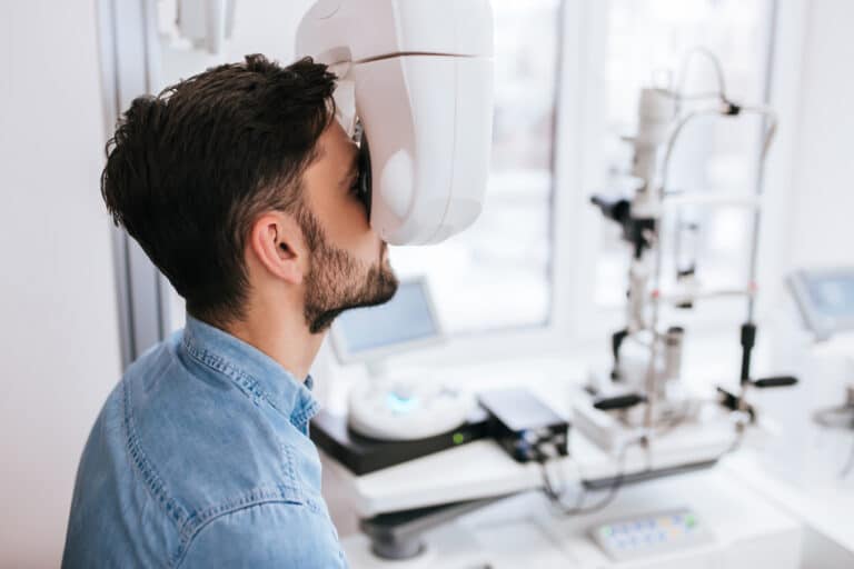 Man Checking Eye Vision in Opthalmology Clinic