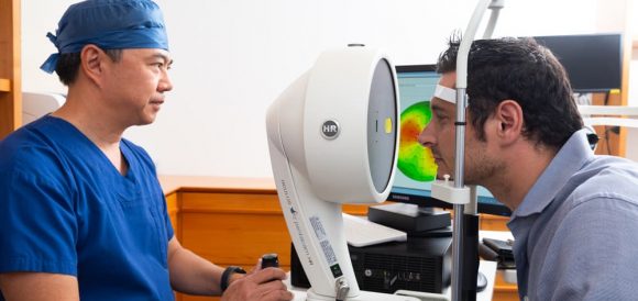 Doctor Checking Patient's Eye — Ophthalmologist In Southport, QLD