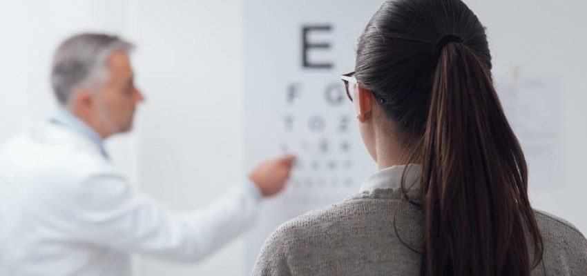 Woman Reading The Eye Chart